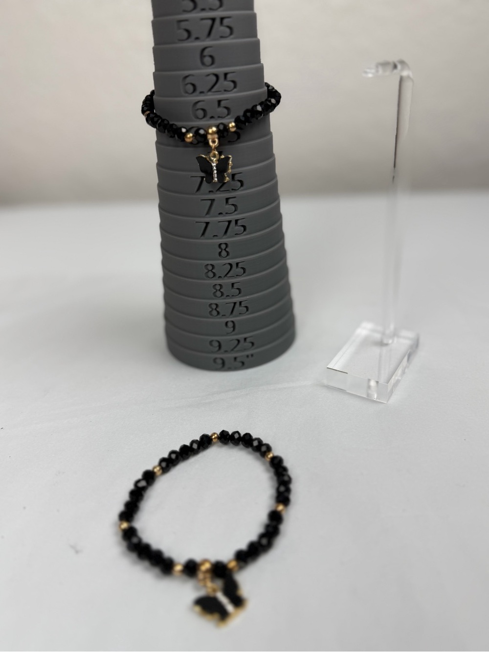 Black Beaded Bracelet Set with Gold Accents and Butterfly Charms